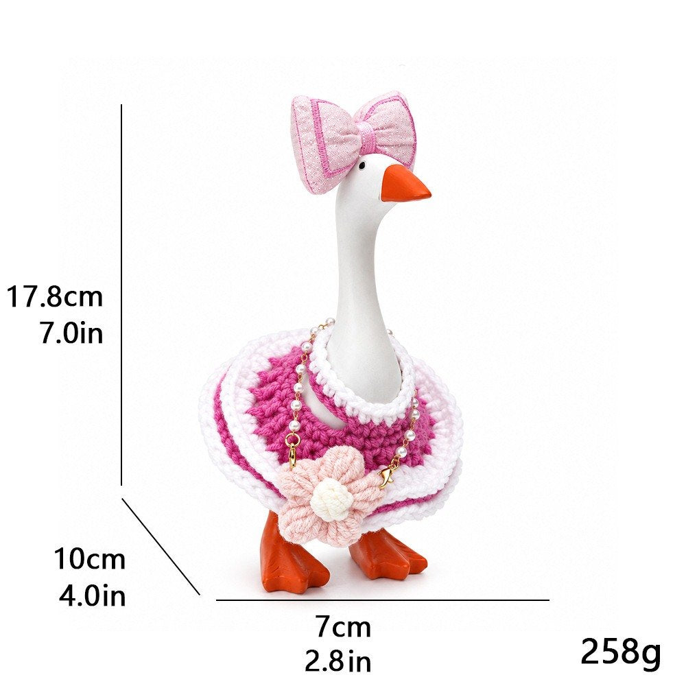 Crochet Poncho, Bow & Flower Purse outfit on a 7-inch Little Honk desk goose