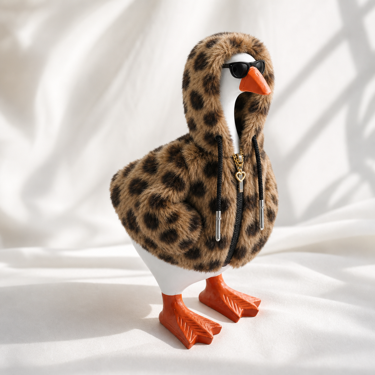 Side view of leopard faux fur hoodie outfit on Desk Goose