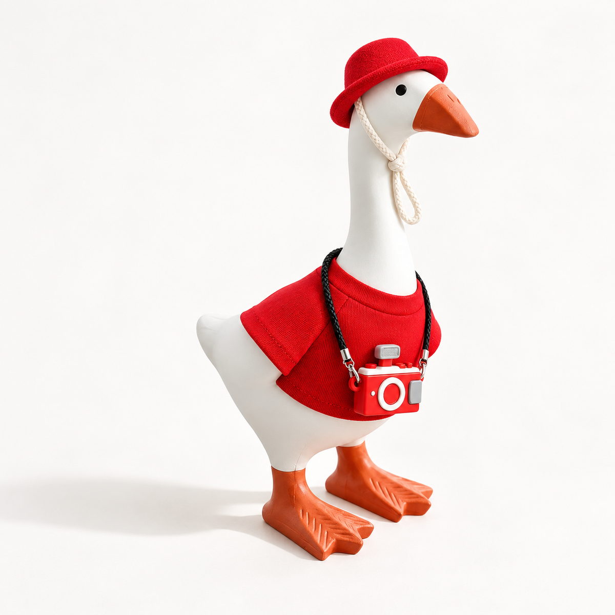 Red Color Pop outfit with matching hat and camera charm on a 7-inch Little Honk Desk Goose