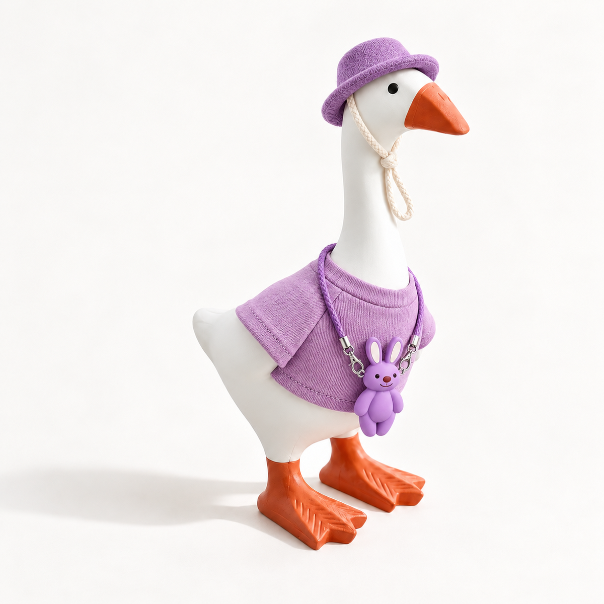 Purple Color Pop outfit with matching hat and bunny charm on a 7-inch Little Honk Desk Goose