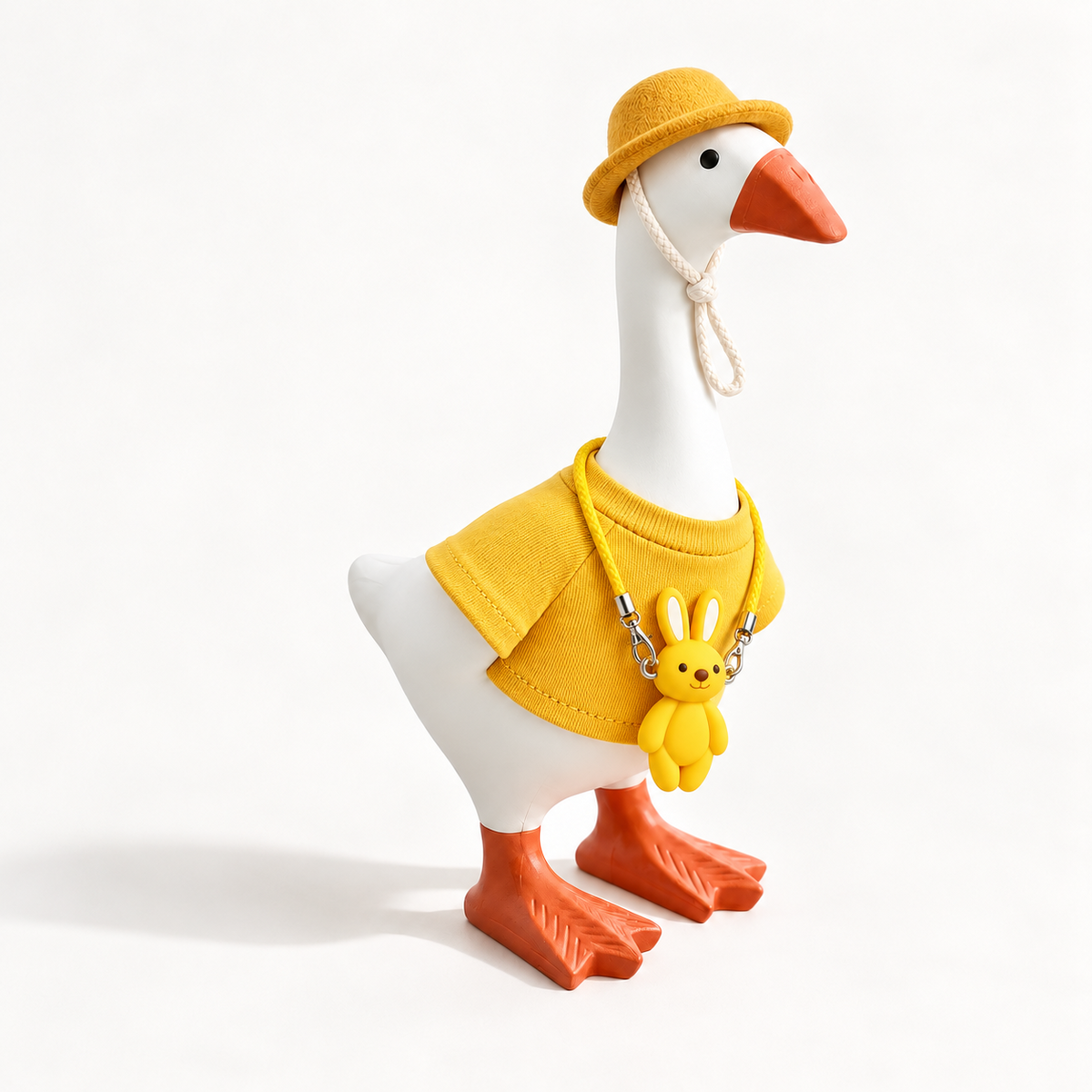Yellow Color Pop outfit with matching hat and bunny charm on a 7-inch Little Honk Desk Goose