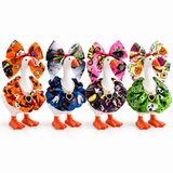 Four Halloween bow and ruffled collar outfit styles for a 7-inch Little Honk Desk Goose