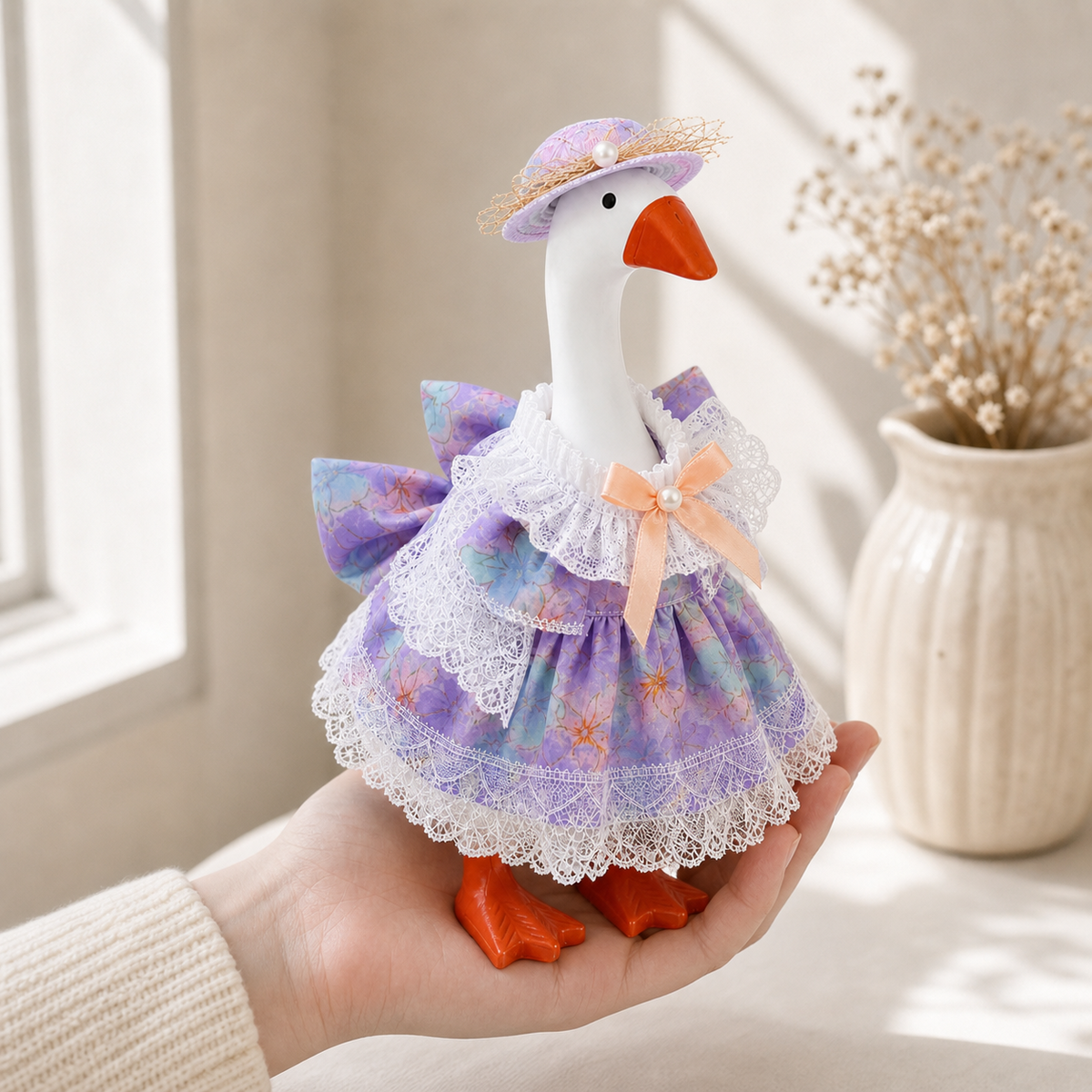 Handheld view of Little Honk purple blue floral outfit set
