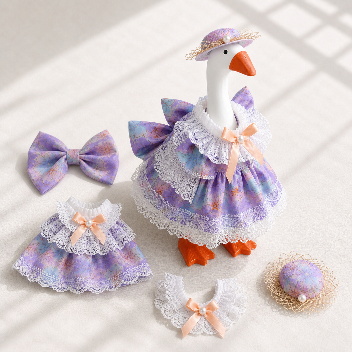 Purple blue floral outfit set pieces displayed with Little Honk