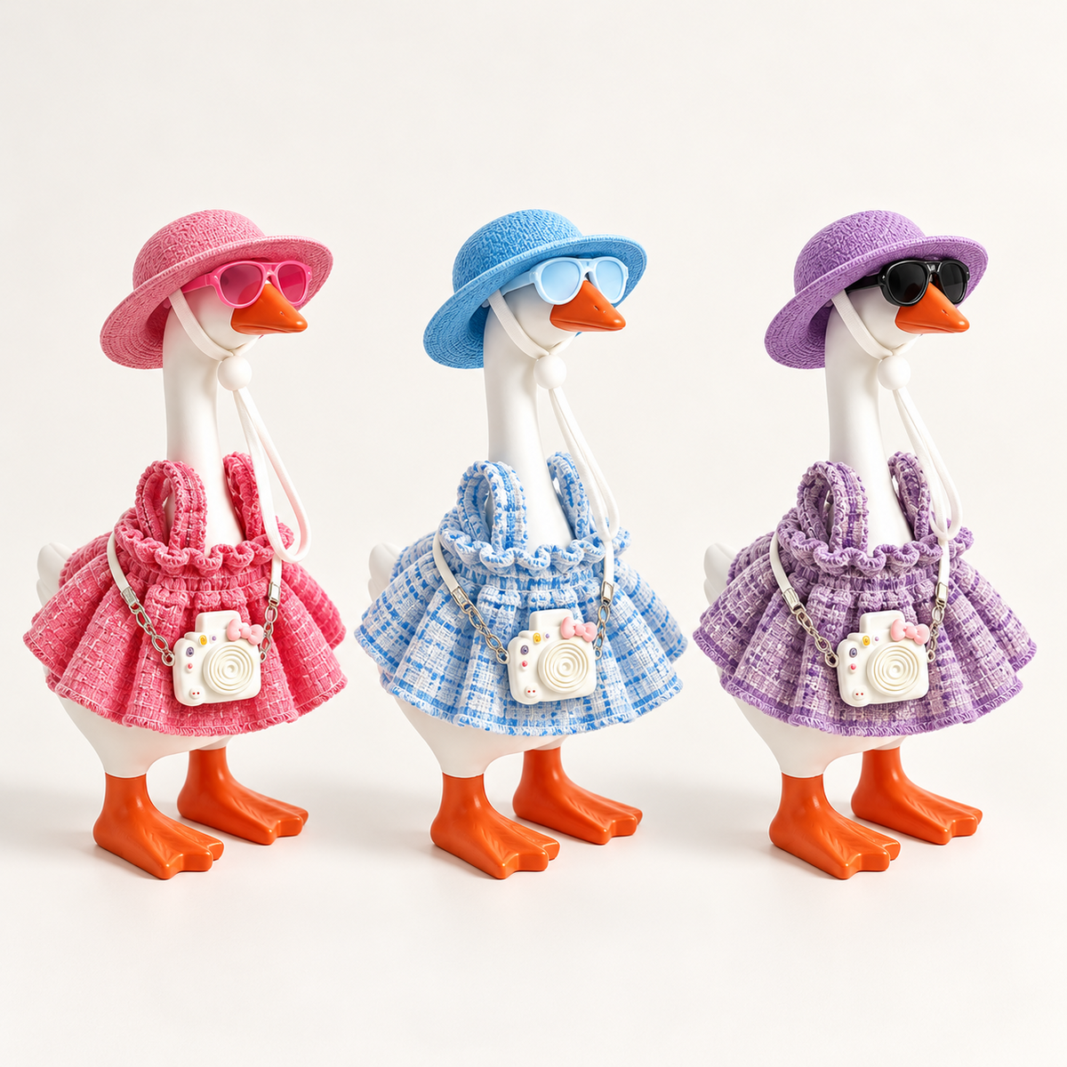 Pink, blue and purple vacation camera outfit color options for a 7-inch Little Honk Desk Goose